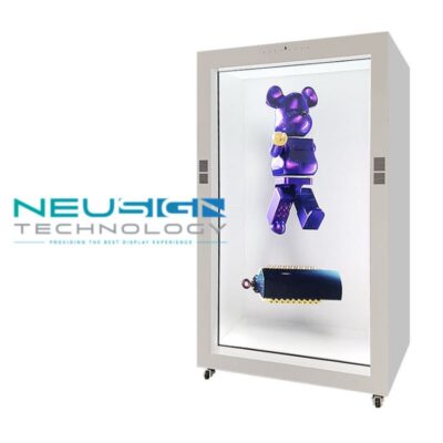 A transparent LCD screen box showing a 3D digital animation of a watch while the physical watch is visible inside