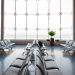 Modern airport lounge showroom featuring comfortable seating, stylish décor, display of amenities, and soft lighting to showcase the lounge experience.